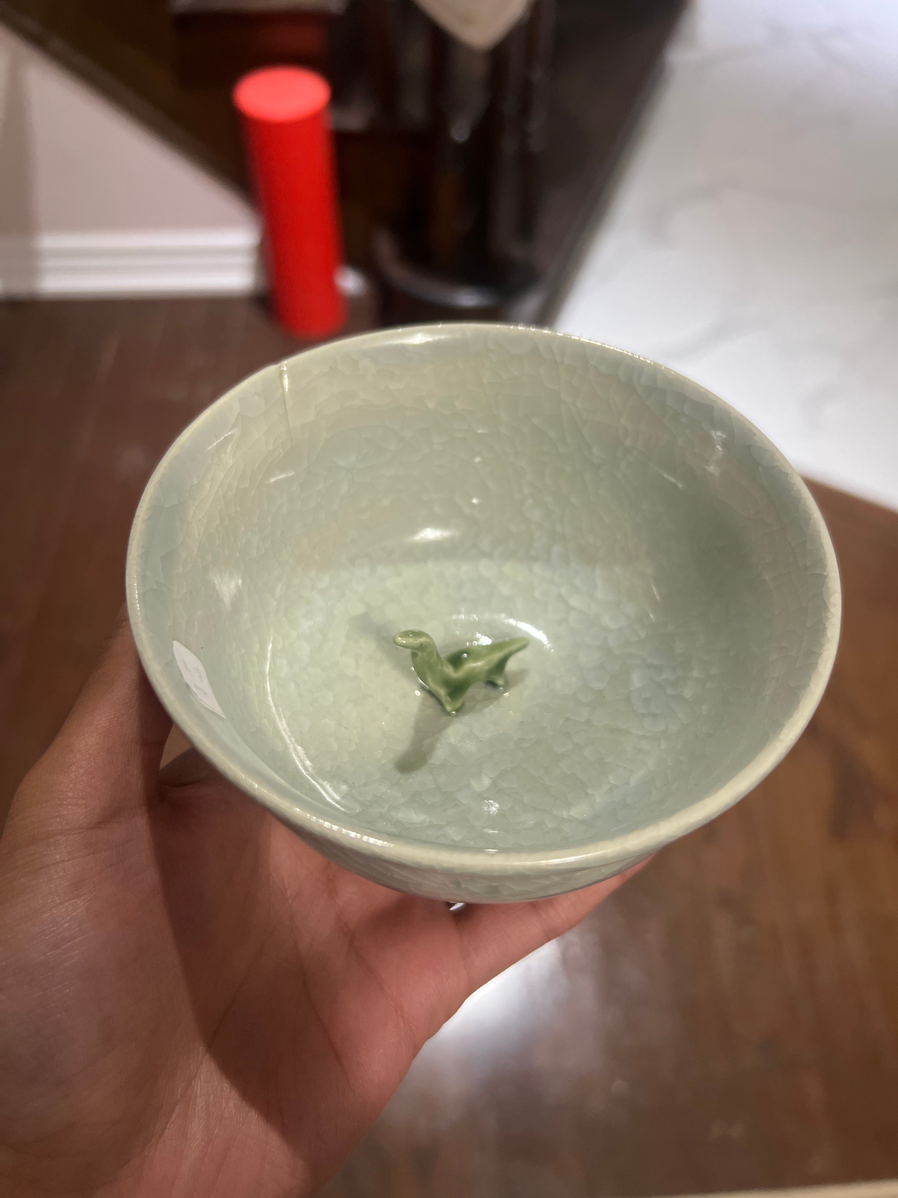 Decorative bowl with a dinosaur
